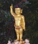 Statue of Shakyamuni Buddha as the young Shakya prince in the courtyard at Hua Zang Si before the Bathing of the Buddha Ceremony held in 2006.