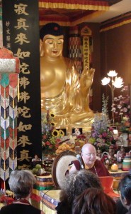 Briefing the Dharma Propagation Tour team at Hua Zang Si under the watchful eye of Shakyamuni Buddha.