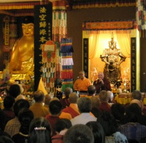Zhaxi Zhuoma Rinpoche addresses those attending the ceremony to receive the treasure book, explaining the scope and purpose of the upcoming Dharma Propagation Tour.r.