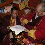 H.H. Dharma King Omniscience Achuk Lama stamps his second fingerprint onto the recognition letter he wrote recognizing the identity of H.H. Dorje Chang Buddha.