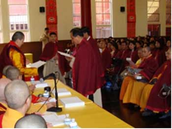 The renowned female Rinpoche from Tibet, Akou Lamo Rinpoche, along with other Examination Committee members, present to Masters of Dharma-Listening Sessions a document allowing them to receive the holy form of inner-tantric initiation.