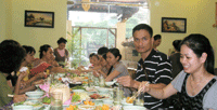 The sangha enjoy a vegetarian feast at "Not in the City" restaurant, as guests of the owner, disciple Vimala (Ha Thu) Nguyen.