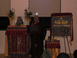 Bright lights flashed as Zhaxi Zhuoma Rinpoche gave a presentation on the treasure book in New York City.